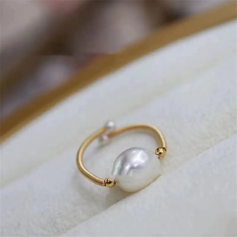 14K Gold Pearl Ring with Winding Design